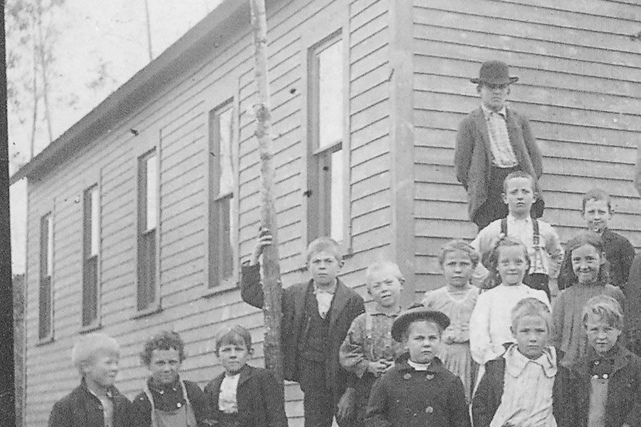 Image of school children in front of Swallow & Hopkins Fall Lake School